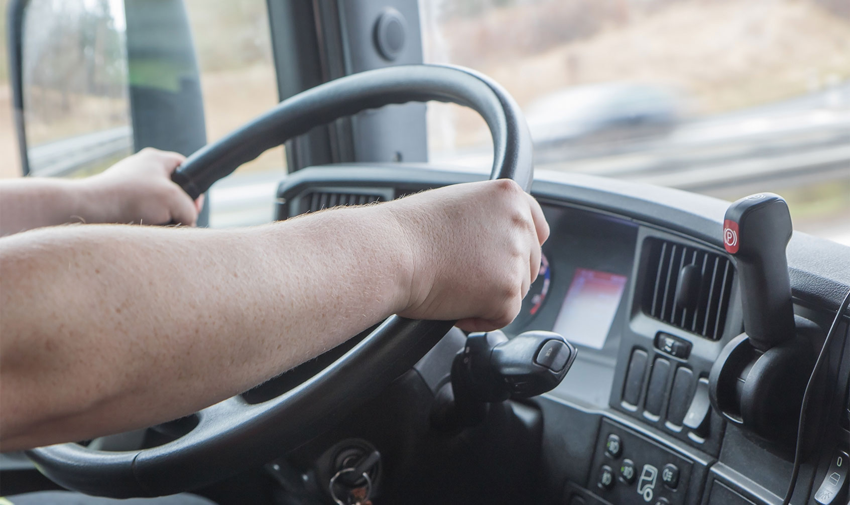 Inline-Landscape-Freight-Driver Person driving a truck